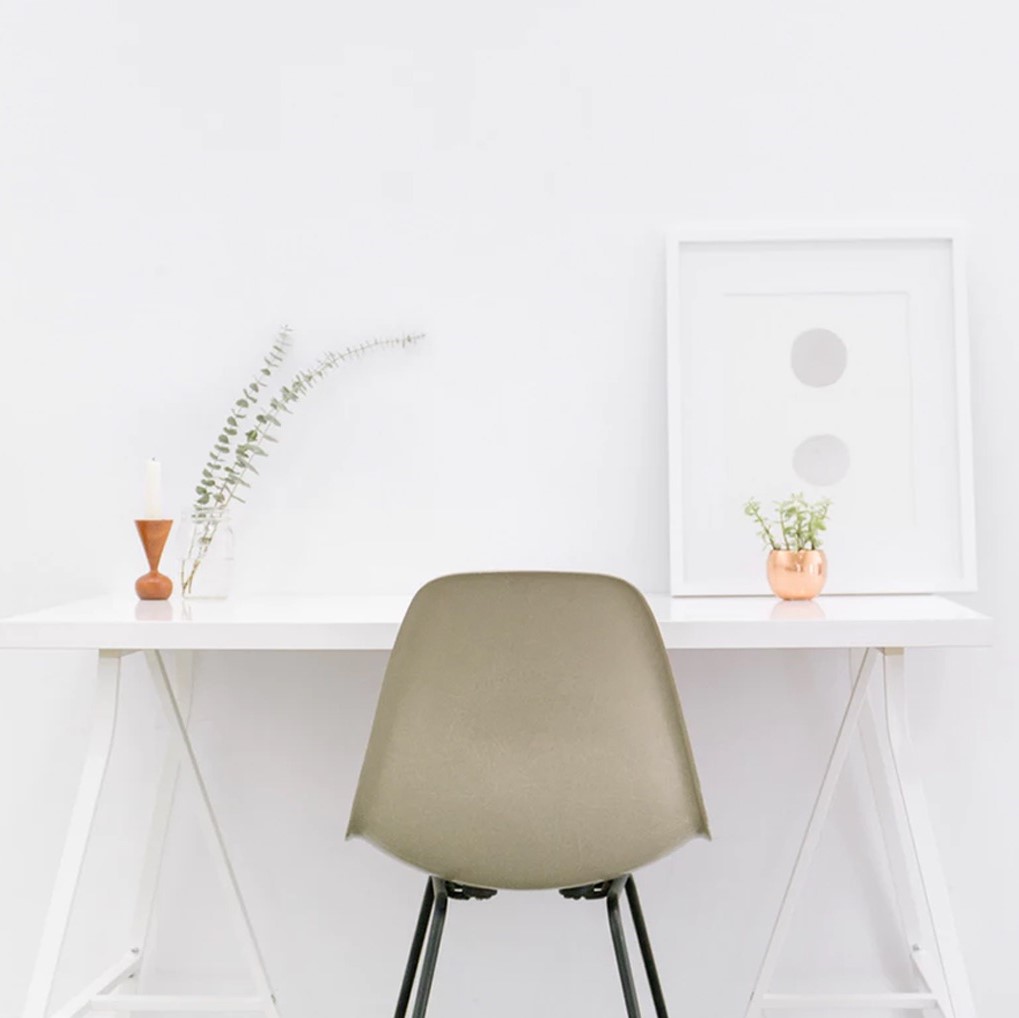 a desk and chair with a white background